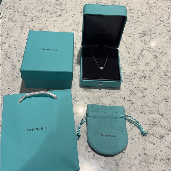Tiffany & Co. Jewelry - Tiffany & Co. Elsa Peretti®
Bean® design Pendant in Platinum with Diamonds, 9 mm